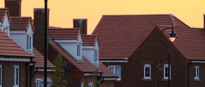 header image, houses in sunset