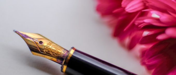 header image, fountain pen and pink flower