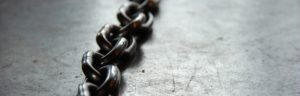 chains; represents chained to the 9-5 JOB