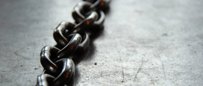 chains; represents chained to the 9-5 JOB