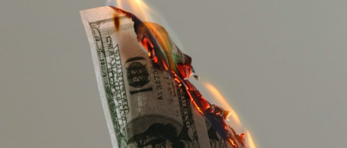 vertical image; burning money